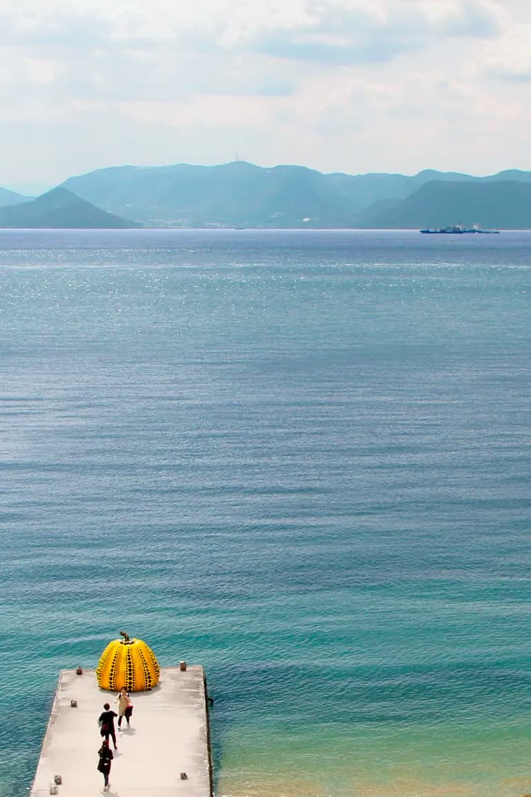 Yayoi Kusama’s “Pumpkin” sculpture at the Setouchi Triennale art fair; photo featured on Condé Nast Traveler
